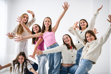 Group Of Teenage Girlfriends on studio white background