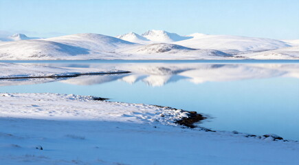 Serene Snow-Covered Lake with Mountain Reflections