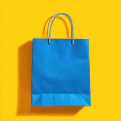Blue paper bag yellow background shopping concept retail packaging minimal design bright color copy space sale idea modern style eco friendly
