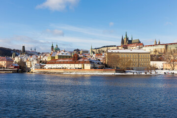 Fototapeta premium Snowy Prague Lesser Town with gothic Castle, Czech Republic 