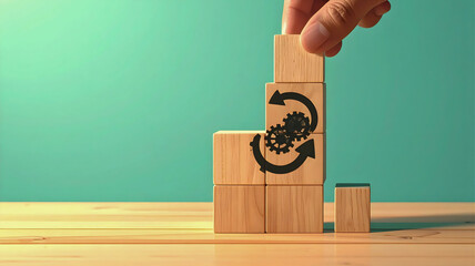 Hand arranging wooden blocks with gear and arrow icons, symbolizing continuous business process improvement, agile workflow optimization, and strategic development for efficiency and growth