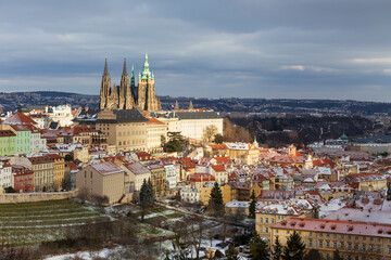 Fototapeta premium Snowy Prague Lesser Town with gothic Castle from Hill Petrin, Czech Republic 