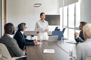 Professional woman leading business meeting presentation in office