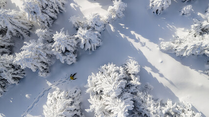 Beautiful Winter Mountain Scenery with Man on Snowshoes , Aerial