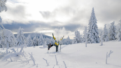 Beautiful Winter Mountain Scenery with Man on Snowshoes , Aerial