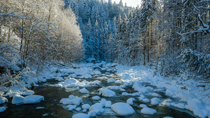 Beautiful Winter Mountain River Covered with Ice and Snow