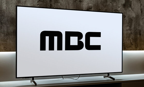 Flat-screen TV set displaying logo of MBC