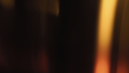 Blur colorful gold crystal light leaks on black background. Defocused abstract yellow and orange retro film lens flare bokeh analog photo overlay, screen filter effect. Glow Vintage prism warm colors