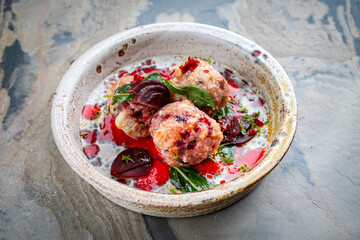 Homemade vegan bread knodel dumpling with beetroot and fresh buttered sage