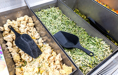 Frozen vegetables are sold at the grocery store. A good natural product for fast cooking delicious food