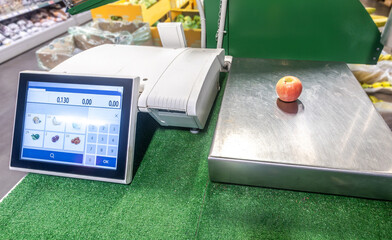 Digital scales with screen for product weighting in supermarket