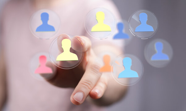Close up shot of a hand touching a futuristic interface with human silhouette icons, representing networking and connection concepts. - Powered by Adobe