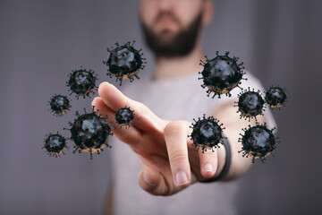 Conceptual image of a man touching or interacting with floating viruses symbolizing a health crisis and the th