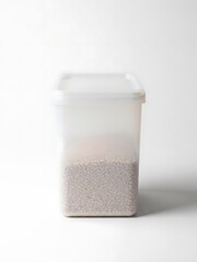 A clear plastic food container filled with small grains on a bright white background