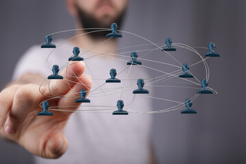 Visual of a network concept. Human hand touching a digital people network symbolizing connectivity, communication, and relationships, perfect fo