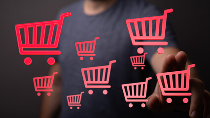 Person interacting with shopping carts symbolising online shopping concept and ecommerce, concept of digital shopping, shop online and technolog © vegefox.com