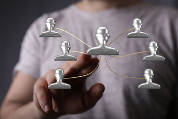 Concept of digital networking, connection, teamwork, global communication, with human hand touching icons. Modern technology for sharing ideas a