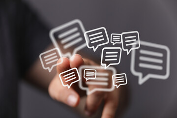 Abstract image depicting hand interacting with message bubbles. Concept of communication,...