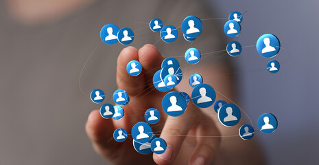 Hand touching network icons representing social media connection, global network, communication, and community. Concept of teamwork, social inte