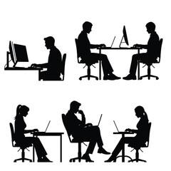 Office workers sitting at desks using computers in a modern workspace environment viewed from the side