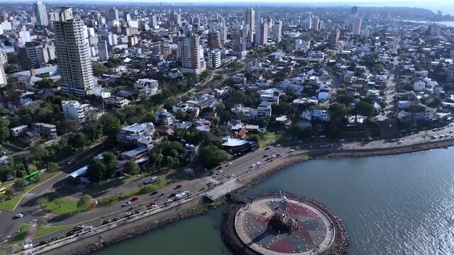 Large stainless steel statue of Andres Guacurari on the riverfront of Posadas. Cultural landmark in Misiones, Argentina.