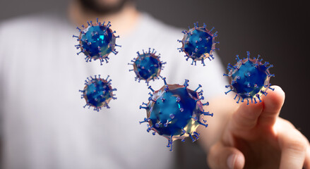 Close-up of a man's hand interacting with abstract floating viruses. Concept of disease, pandemic,...