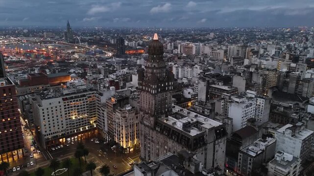 Illuminated Artigas Monument at Plaza Independencia. Night view of Montevideo's Old Town gate and historic district.