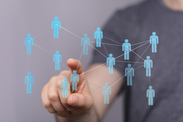 Person interacting with a digital network, representing concepts like connection, communication, and social int