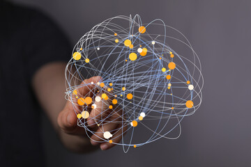 Abstract image showing a hand holding a digital network or globe. Represents global connection, internet, communication, technology,