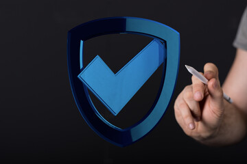 Abstract image featuring a shield icon with a checkmark. Symbolizing security, validation and digital protection. Concept of secure s