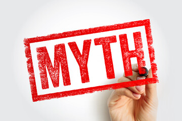 MYTH stamp held by a hand, symbolizing false beliefs or misconceptions. Useful for educational...