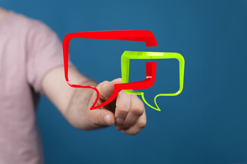 Hand holding vibrant chat bubbles representing communication, discussion, and dialogue. Perfect for technology,