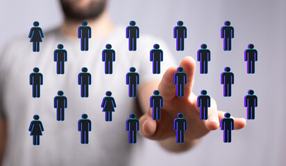 Hand pointing at a network of people symbols, concept of social connections and communication