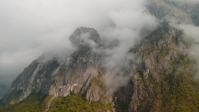 Spectacular Dolomite mountain landscape with mist and clouds, Italy