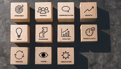 Business Strategy Grid – Wooden Blocks with Icons and Keywords Representing Organizational Development Concepts, strategy, teamwork, growth, productivity, innovation, communication, ideas, analysis