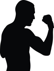 Powerful silhouette of a muscular man showing a clenched fist in a strong athletic pose