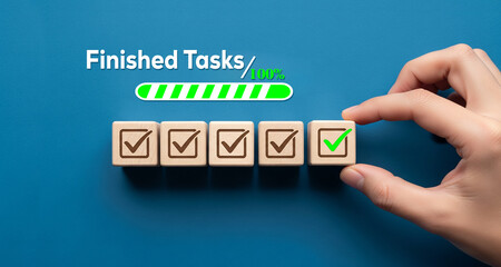 Hand Completing Finished Tasks List with Progress Bar and Wooden Blocks with Check Marks
