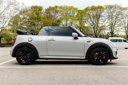 April 13, 2021, Seoul, South Korea - Silver Mini Cooper Convertible JCW parked in an outdoor lot with its top down