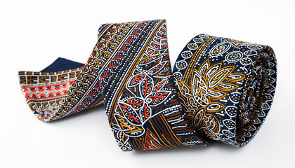 Colorful patterned fabric ribbons with intricate embroidery close up.