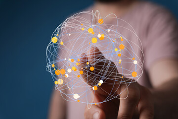 A person's hand touching a network globe, representing the connection, communication, and technological advancement in the digital wo