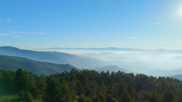 Foggy valley landscape in bright sunlight near Ceranesi, Italy