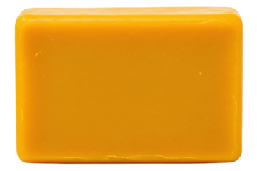 Solid rectangular block of organic yellow beeswax material on a transparent background