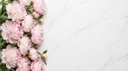 Pink peonies flowers border on white marble background with copy space. Elegant floral flat lay for International Women's Day, Mother's Day or Wedding invitation