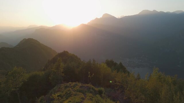 Aerial view from Grande Panchina at sunset over lake and mountain landscape, Capovalle, Italy