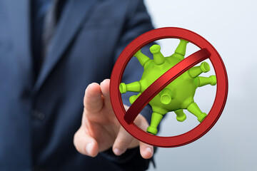 Concept of health and protection from the virus. Man in suit stopping the spread of the...