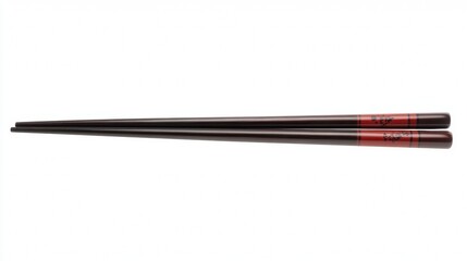 A pair of black chopsticks with red tips on the ends.