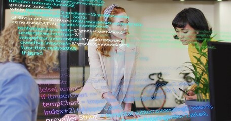 Leaning lead woman in pale blazer guiding team reviewing laptop, papers and code overlay in office