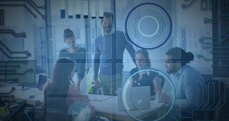 Discussing 5-person team pointing to laptop, green bottle in office wearing business wear with HUD