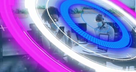 Holding tablet, checking phone, masked pair in office wear working in office with laptop, overlays