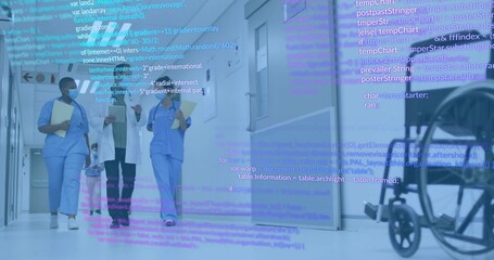 Walking medical trio talking in ward in scrubs lab coat masks with tablet wheelchair code overlay